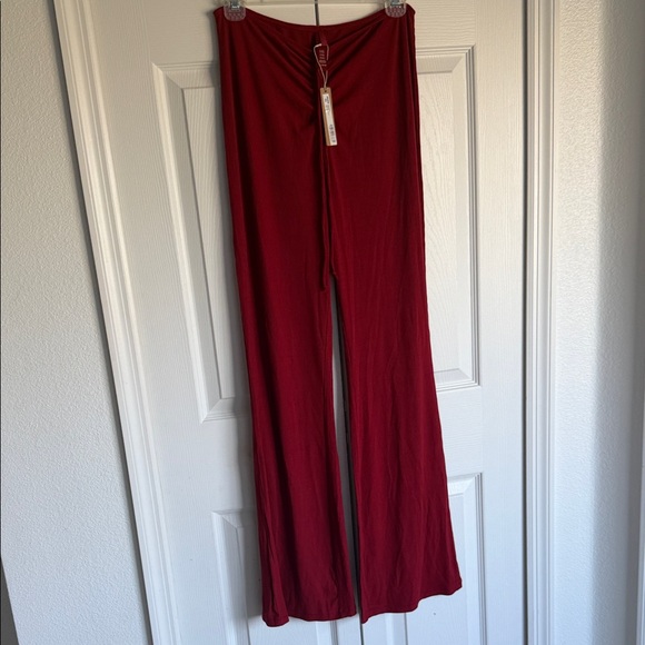 SKIMS Ribbed Drawstring Boot-Cut Pants in Deep Red - Picture 5 of 9